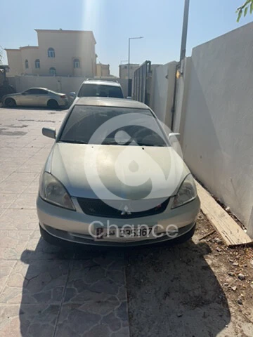 لانسر للبيع كل شي شغال ما فيها اي مشاكل المشكل الوحيد استمارة منتهية لان الصبغ باهت وبس السيارة فل ابشن سعرها 7000 وممشى 380